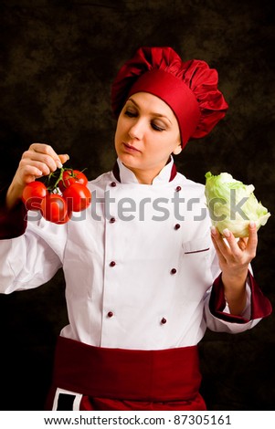 photo of young female chef controlling tomato  quality