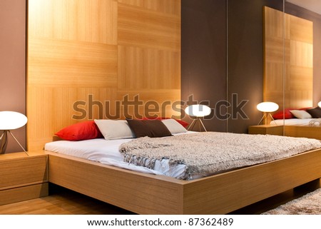 Modern bedroom with wooden wall Royalty-Free Stock Photo #87362489