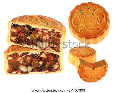 Different types of mooncake with different filling Durian fruit, salted egg yolk, fruitcake. Mooncake is eaten during the mid autumn festival to worship the lunar moon watching isolated on white