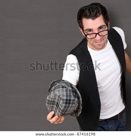 Man holding hat for greetings