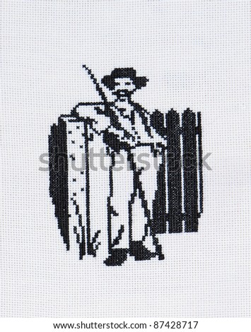 Embroidered good by cross-stitch pattern. The old fashioned farmer standing near the fence