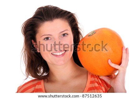 A picture of a young woman with a pumpkin smiling over white background