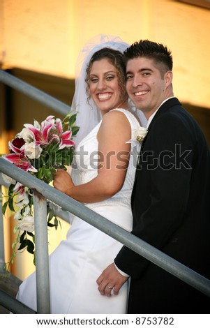 bride and groom on stairs