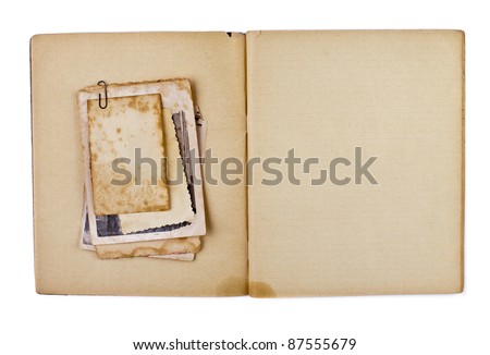 blank old opened diary or copybook with photos bunch isolated on white