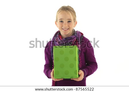 Little girl with a gift against white background
