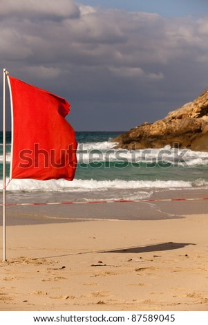 red banner = storm on the beach (mallorca island in spain)