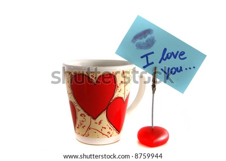 Happy Valentine's Day An isolated shot of a cup with hearts and an "I love you" note. A lot of white space for text.