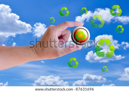 hand holding recycle button against blue sky