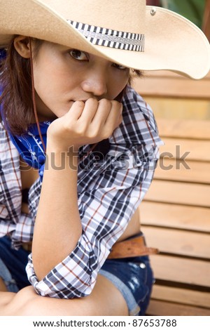 cowgirl sit on bench