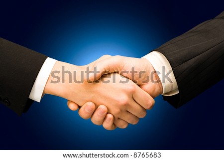 Conceptual photo of business people’s hands making an agreement