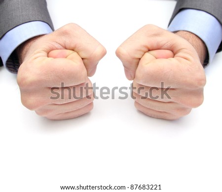 closeup of two fists on a white table