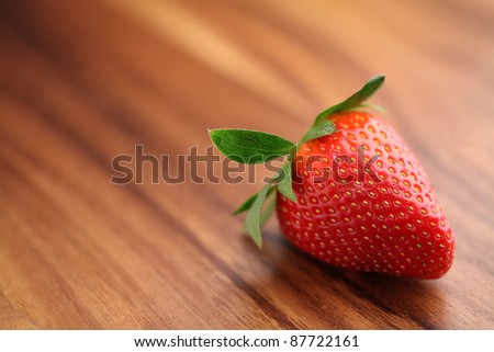 Close-up of strawberry on wood