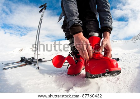 getting ready for skiing - fastening the boots