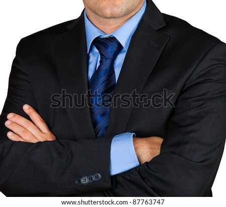 Businessman isolated on white background, with arms crossed.