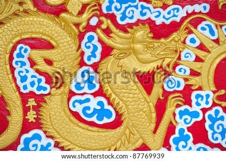 golden dragons in chinese style on red background