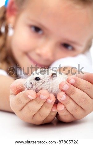 My little pal - girl holding her hamster in palms Royalty-Free Stock Photo #87805726