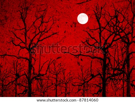Photo composition with full moon at night,dead tree