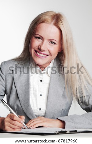 business woman writing in notebook