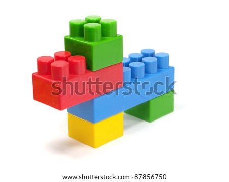plastic building blocks dog on a white background