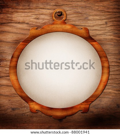 vintage classical frame on grunge wooden background