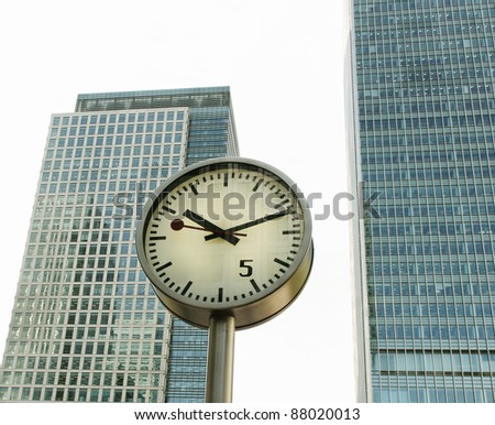 One clock on the skyscraper background. Royalty-Free Stock Photo #88020013