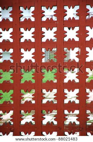 Red wooden grid background. Element of old wooden gate.