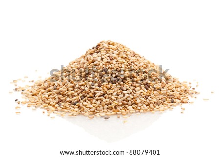 Heap of organic natural sesame seeds over white background Royalty-Free Stock Photo #88079401