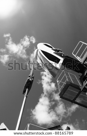 Oil and gas industry. Work of oil pump jack on a oil field. Bottom view. Black and white photo