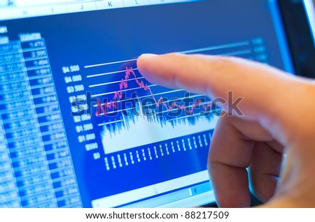 business chart on a touch screen tablet-pc Royalty-Free Stock Photo #88217509