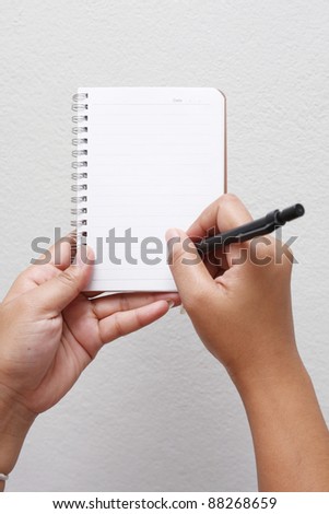hand writing by pencil on notebook