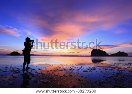 The Photographer  Photographer takes a good shot on the PangMeng beach,Trang, Thailand