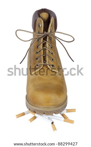 yellow shoes on cigarettes isolated on white