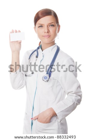 Friendly doctor with a blank card, isolated over white