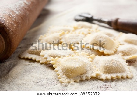 Making homemade ravioli with a wooden roller Royalty-Free Stock Photo #88352872