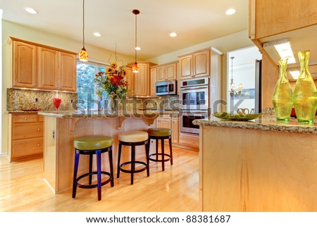 Large luxury maple wood kitchen with island and stools