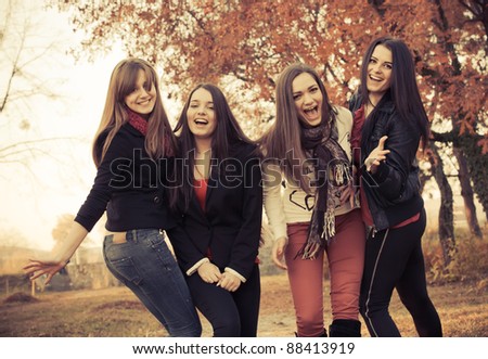 Happy pretty girls in the park Royalty-Free Stock Photo #88413919