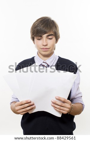 Portrait of young successful man with paper in hands