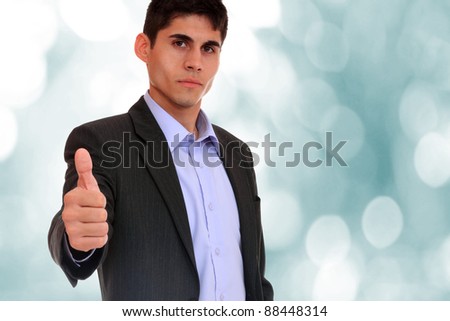 Business man shows thumb up