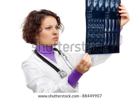 Female Doctor analyzing MRI image; isolated on white
