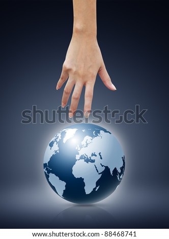 Women hand  pointing down to the globe