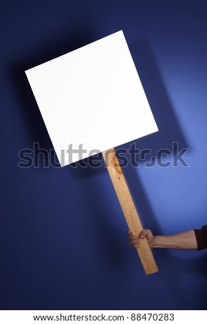 Blank sign held by hand and customizable with your message.