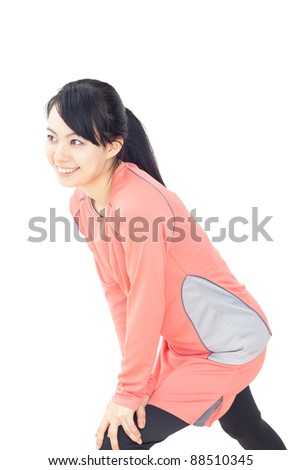 Beautiful young woman makes stretching isolated over white background