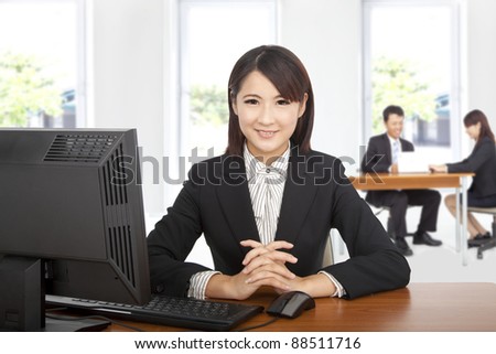 Pretty asian  business woman at office desk with computer