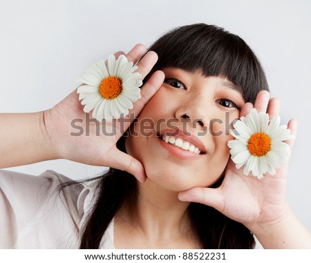 Young Chinese girl with flowers