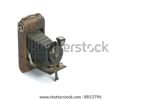 Classic folder bellows camera on white background