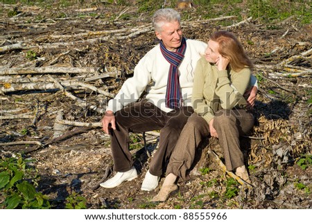 cute old couple sitting at the roots