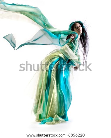 Beautiful Asian woman in sorceress outfit on white background
