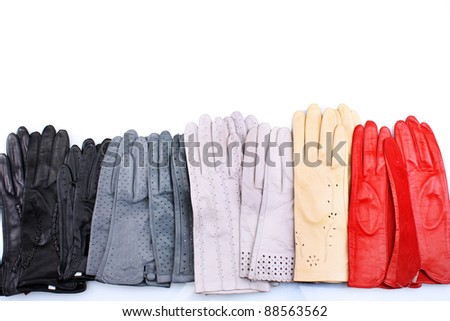 lot of beautiful women leather gloves isolated on white