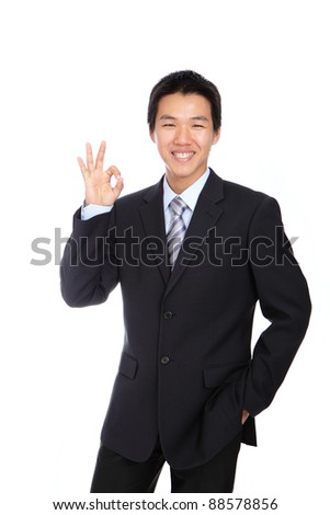 Young Business Man with OK hand gesture , isolated on white background