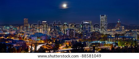 Moon Rise Over Portland Oregon City Skyline and Light Trails at Blue Hour
